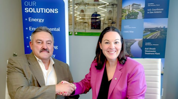 Halff's President and CEO Jessica Baker Daily signing purchase acquisition agreement with C&D Utility Consulting's Romeo Cabrera